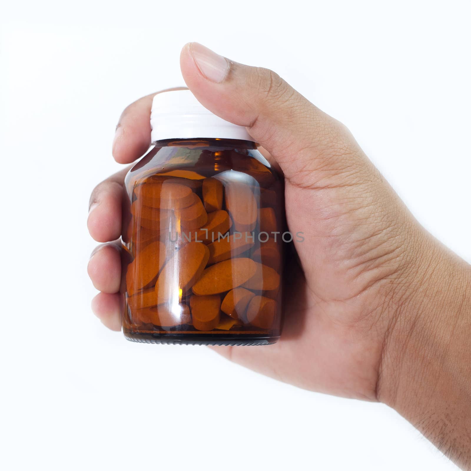 Medicine bottle in a hand