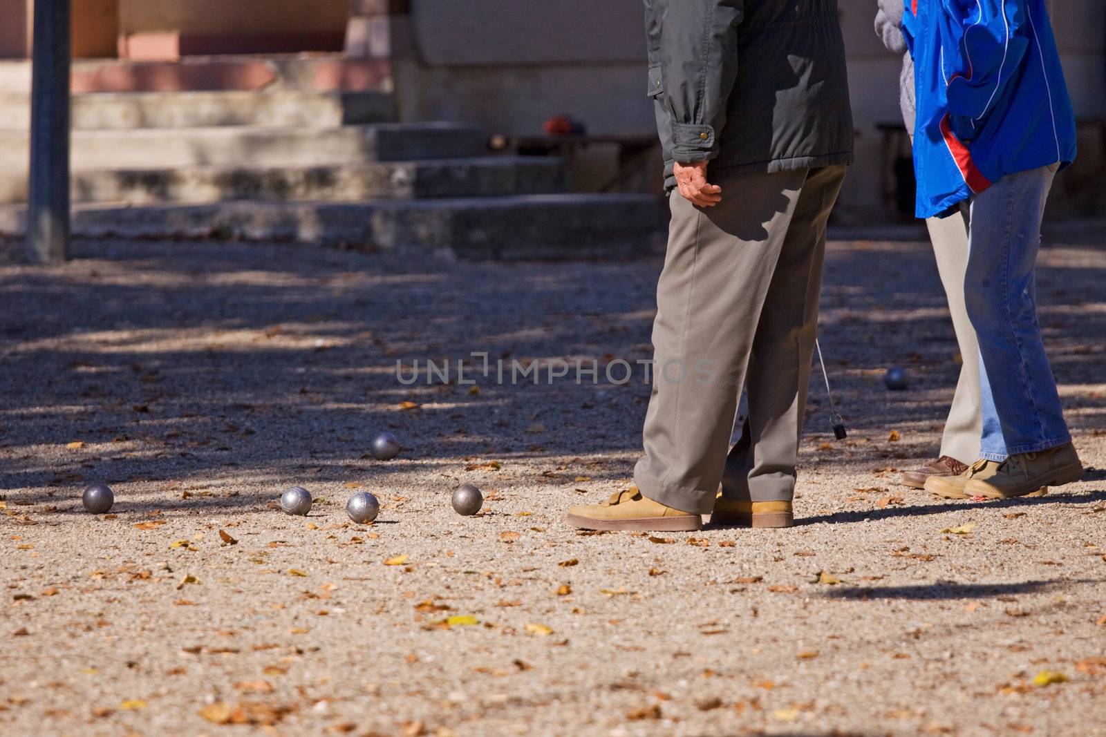 The popular French pastime of Boules played on open ground in the centre of towns and villages