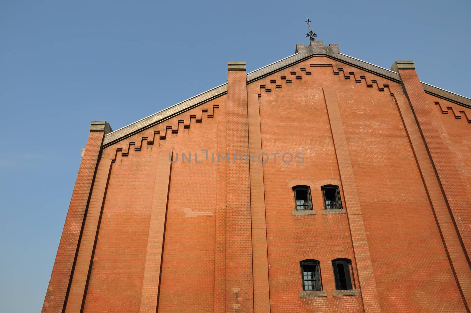 Yokohama port famous red brick warehouse building fragment  over blue sky