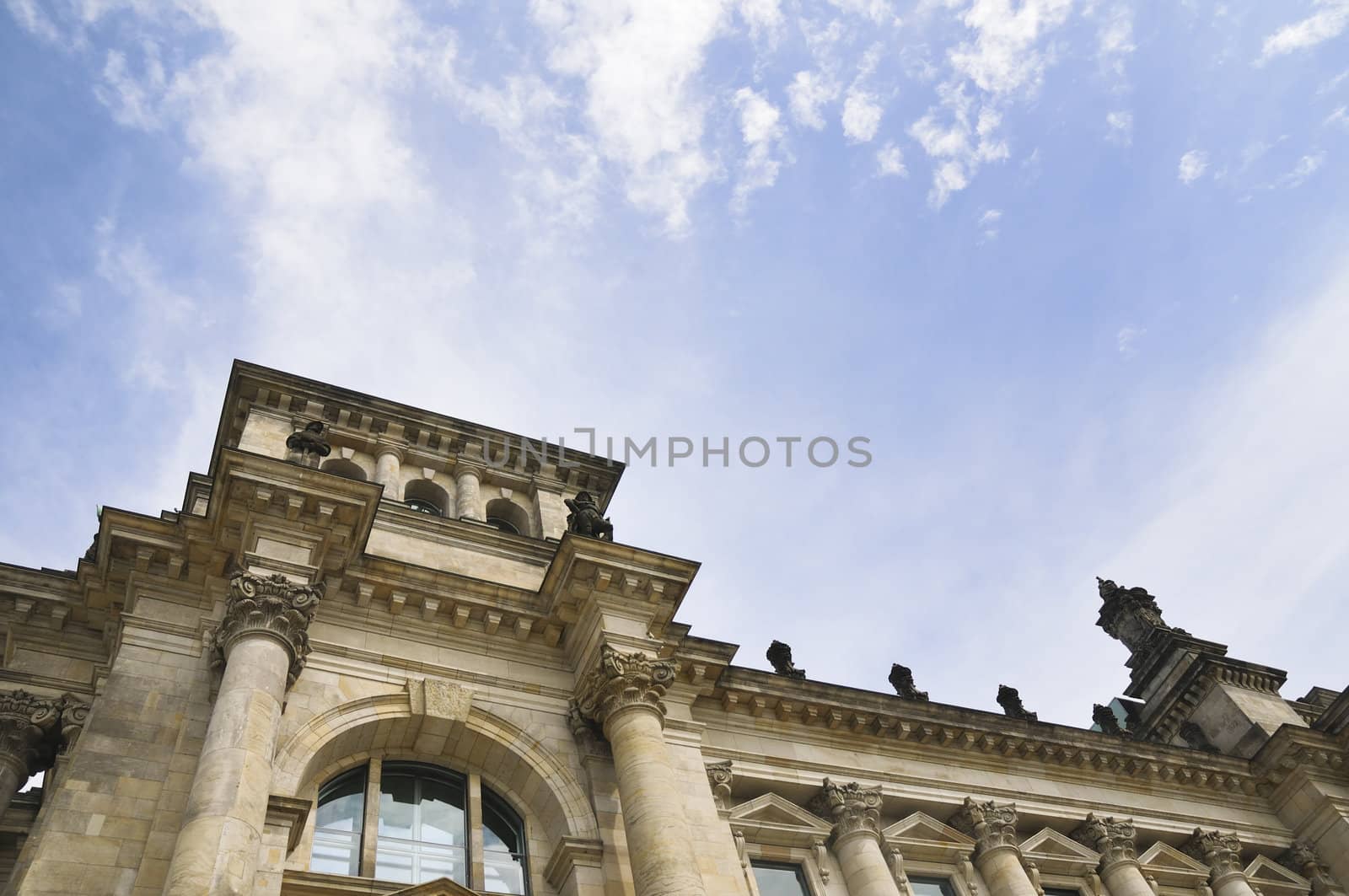 side view to Berlin Reichstag with cloudy sky background