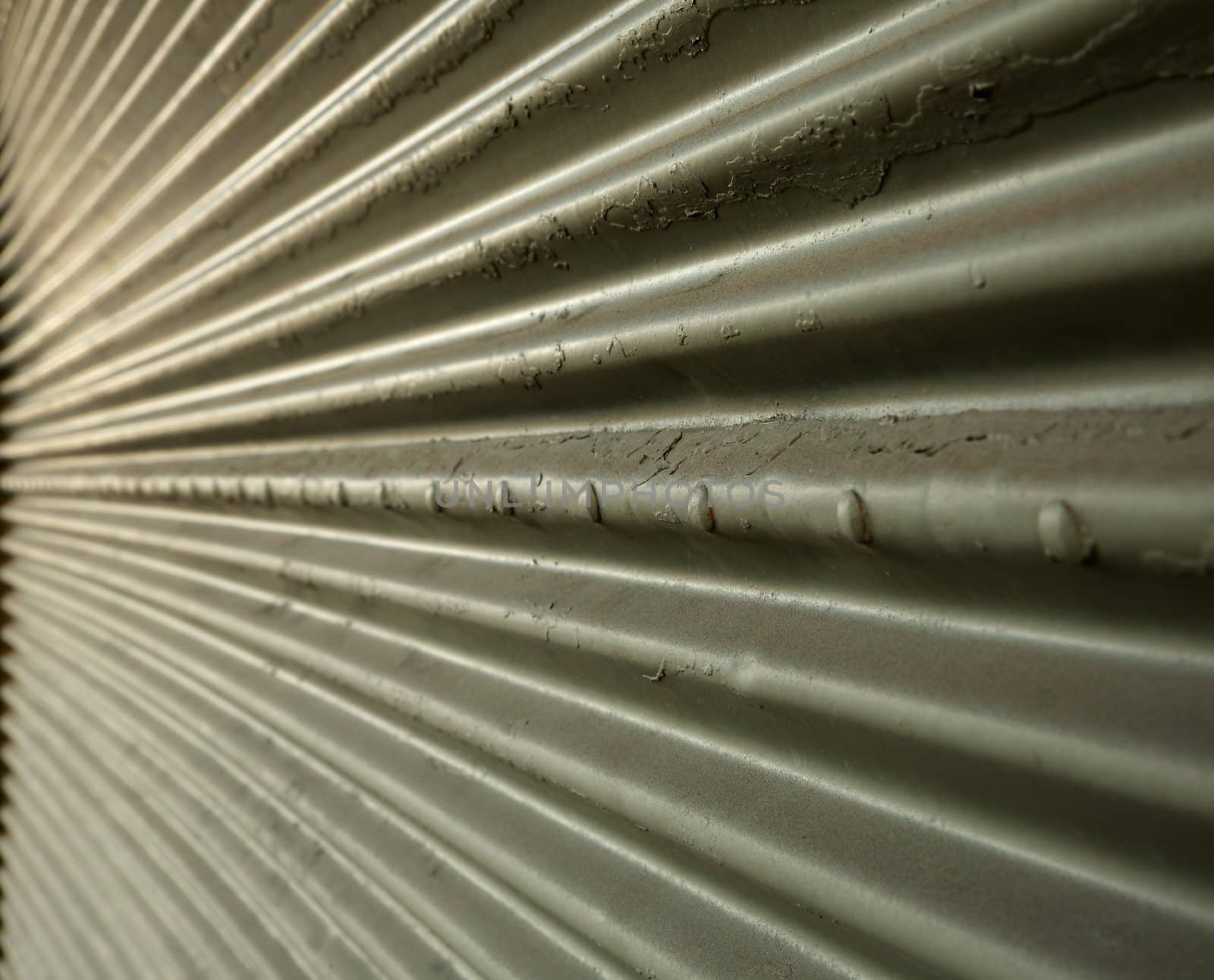 Corrugated steel wall in perspective leading to a point