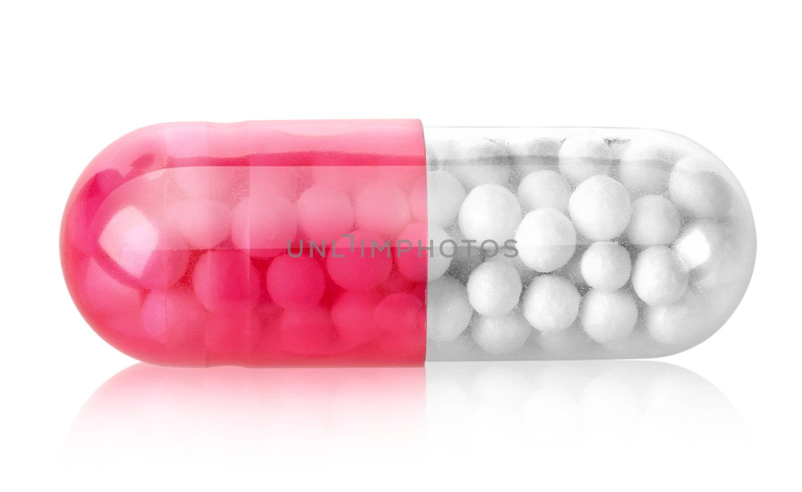 Red capsule isolated on a white background