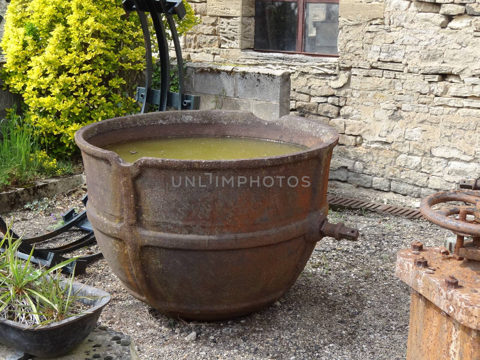 rusty old pot in an old foundry