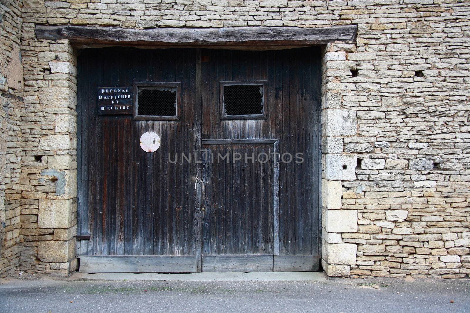 I took that photo in Scey Sur Saone.The door was old like that house