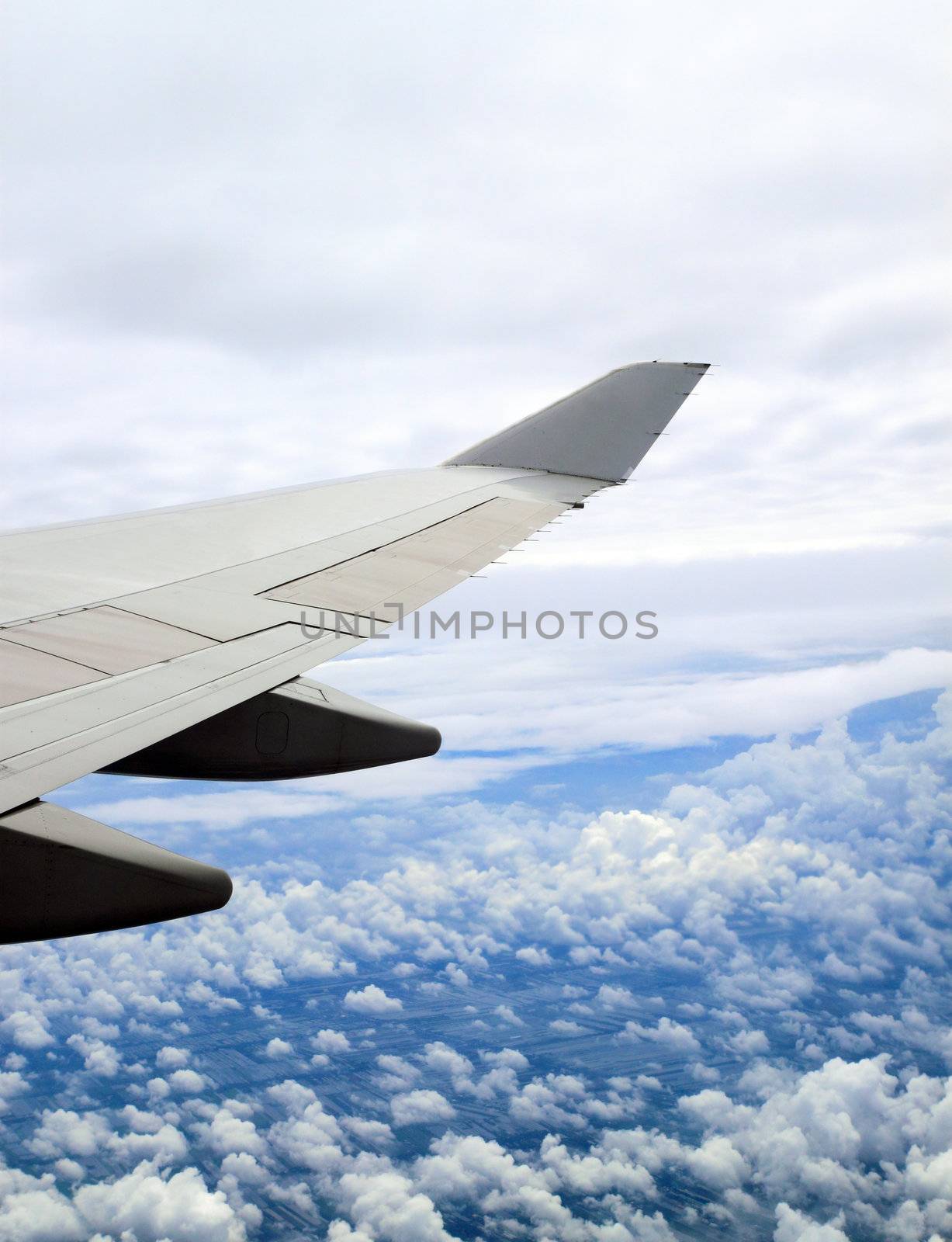 Earth and airplane wing viewing from a plane by geargodz