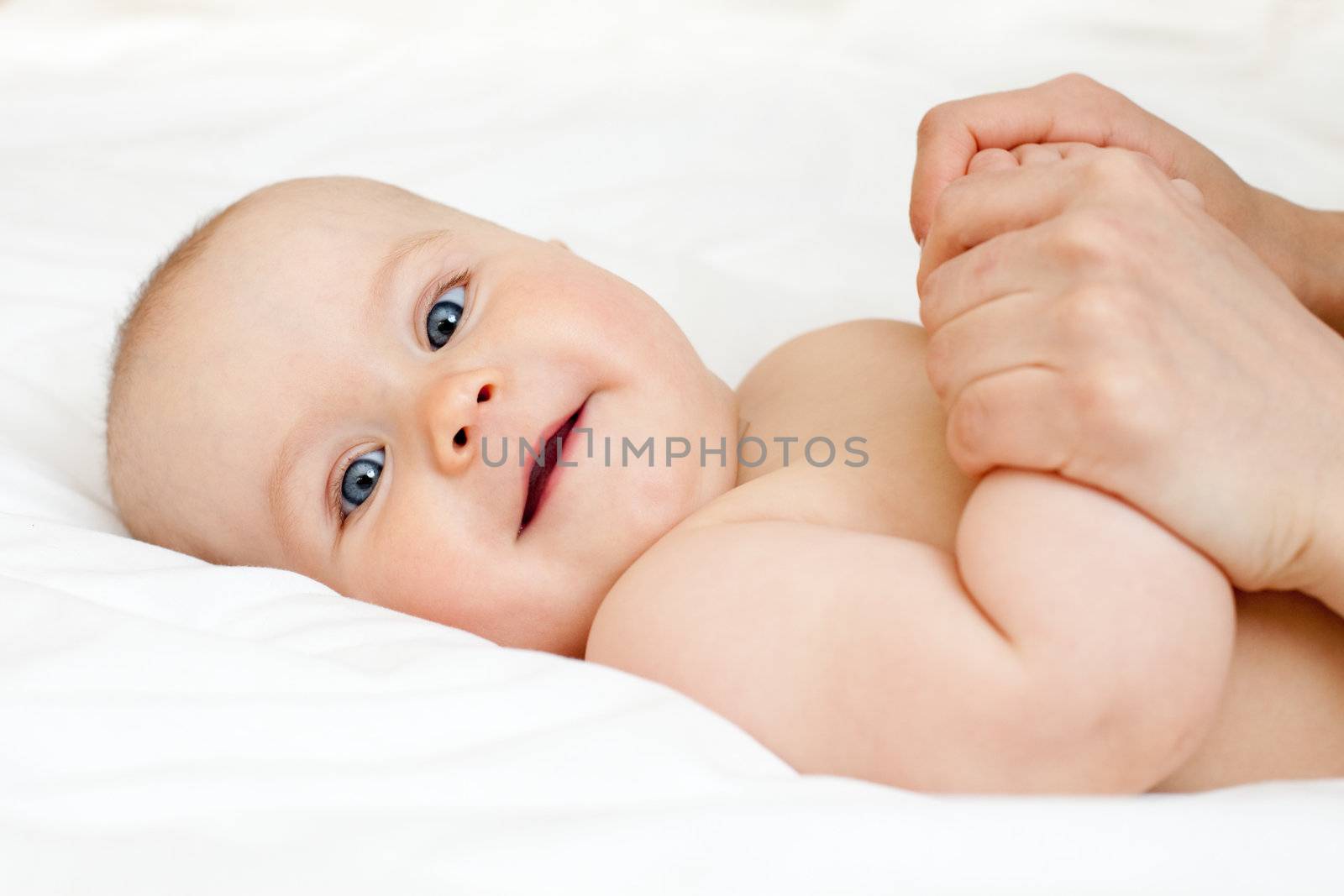 Mother massaging her child, shallow focus