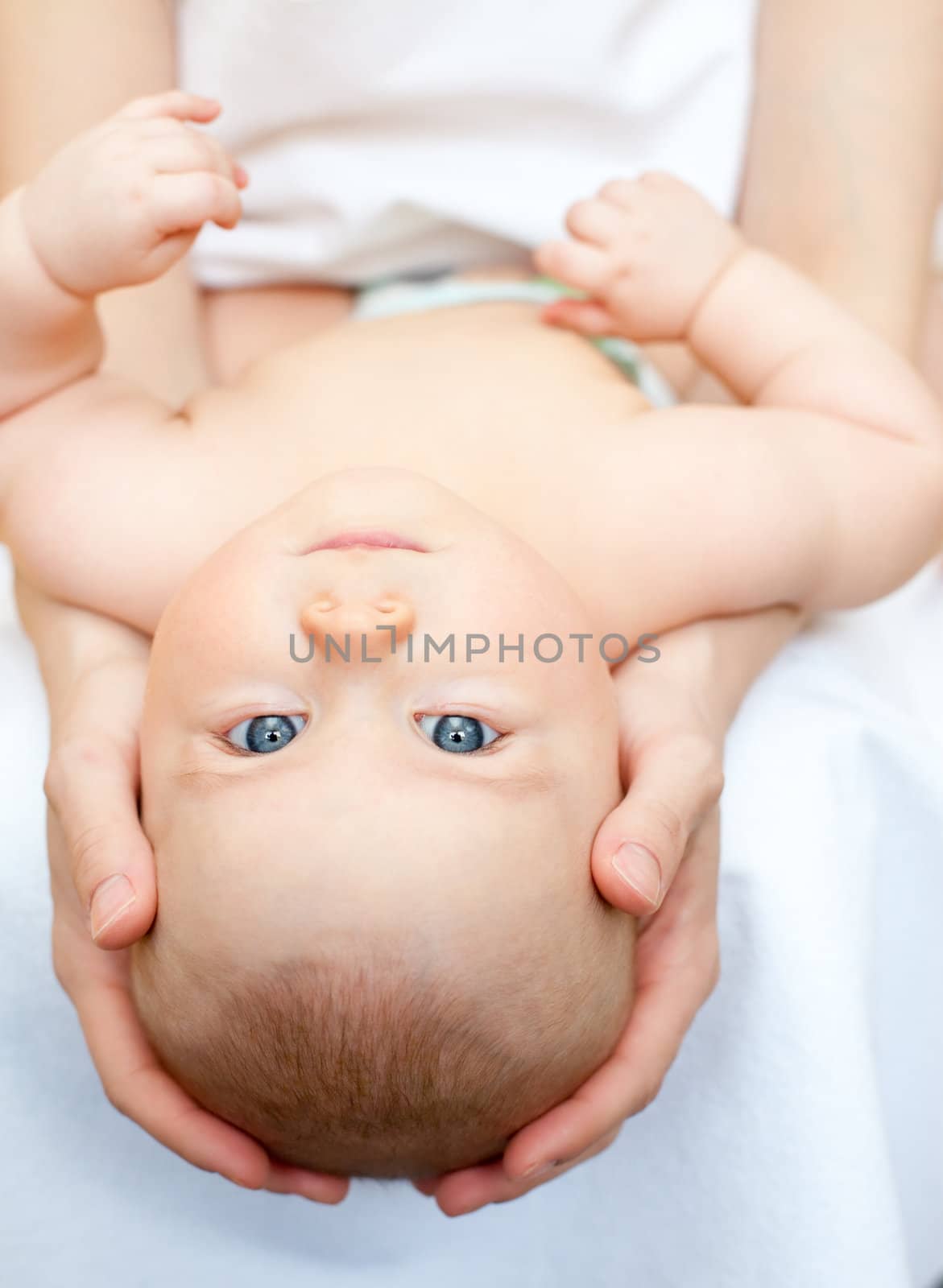 Mother holding little baby girl, shallow focus