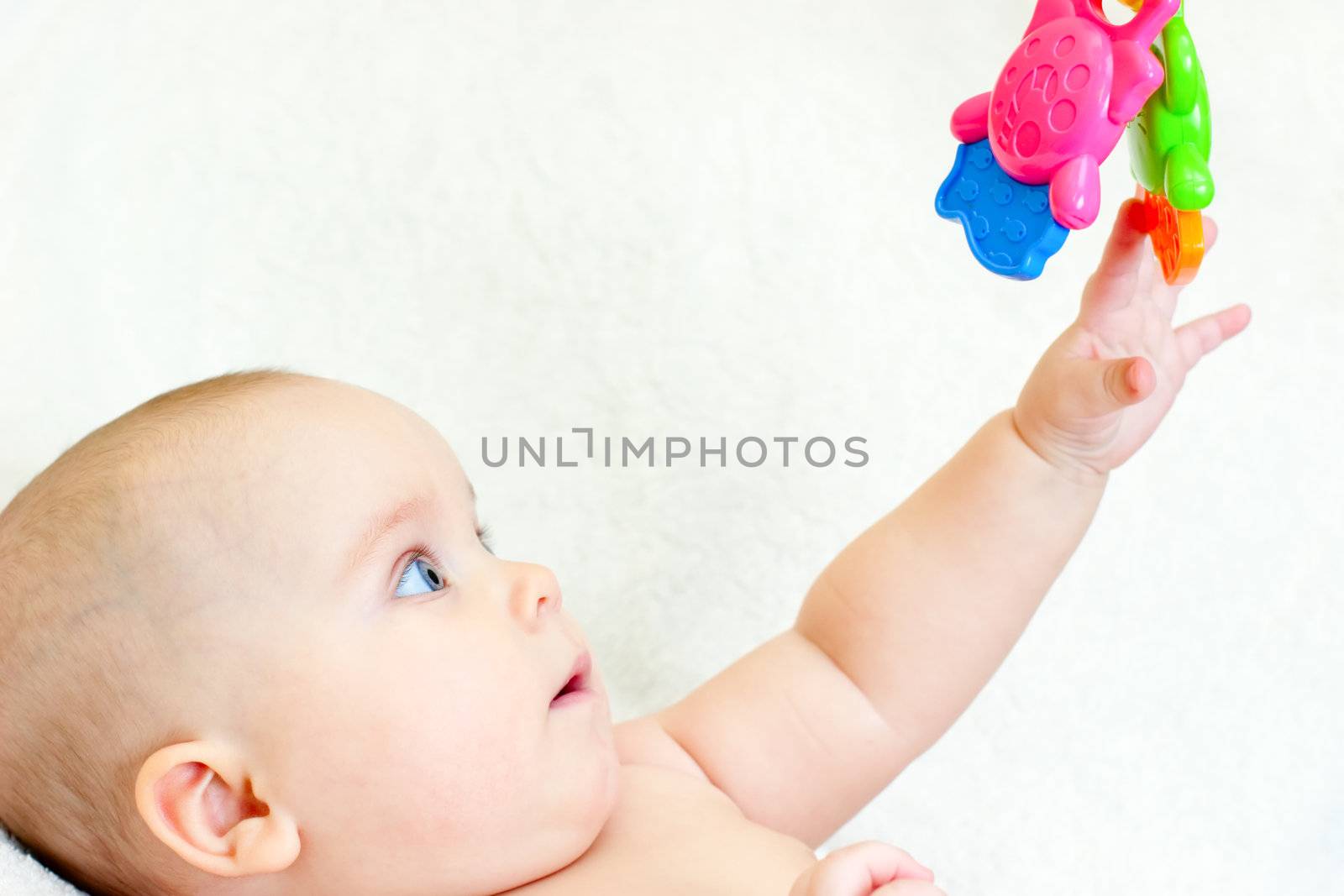 Infant with toy by naumoid