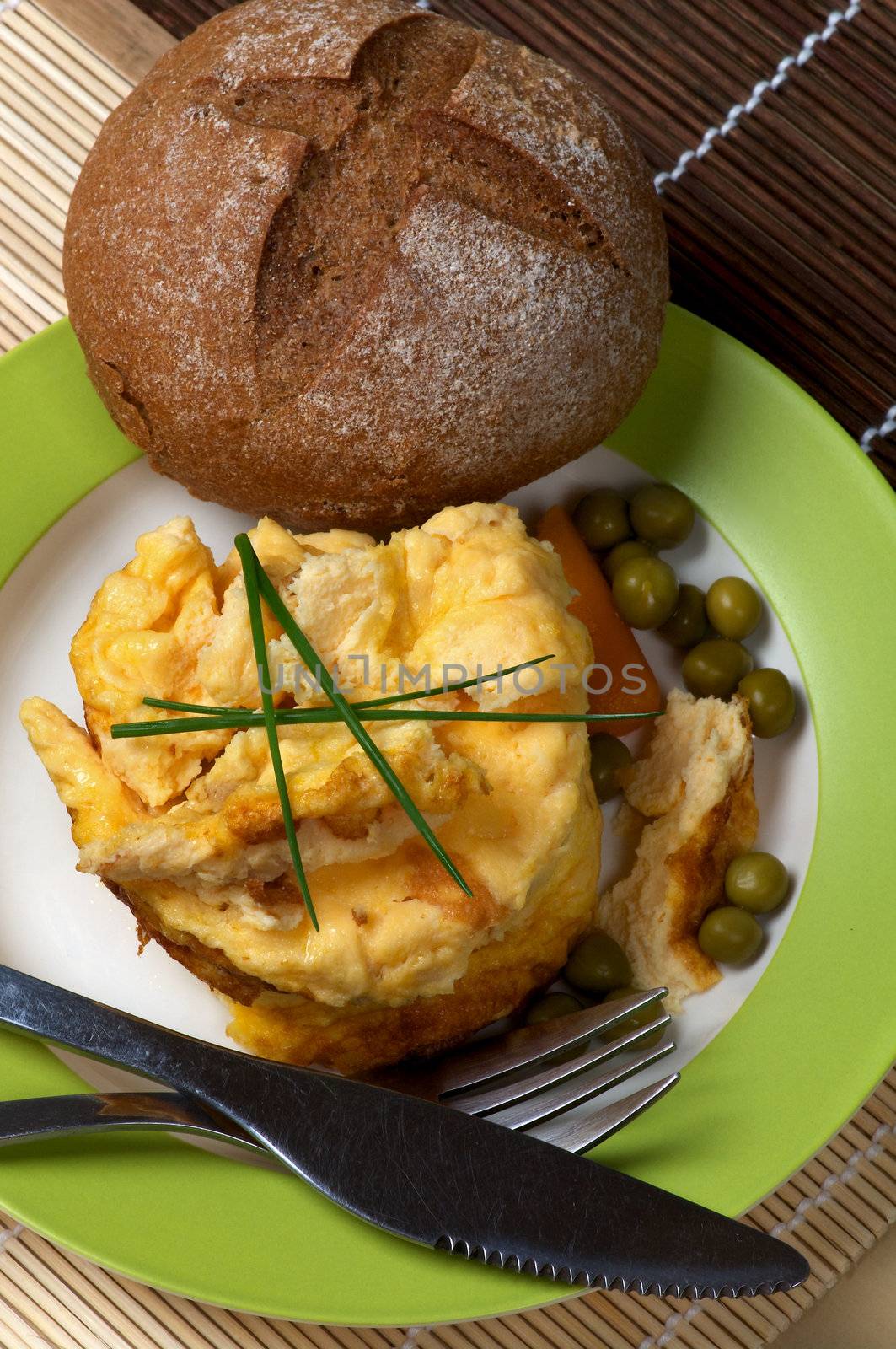 Fluffy Omelet, Carrot and Bun on Green Plate closeup