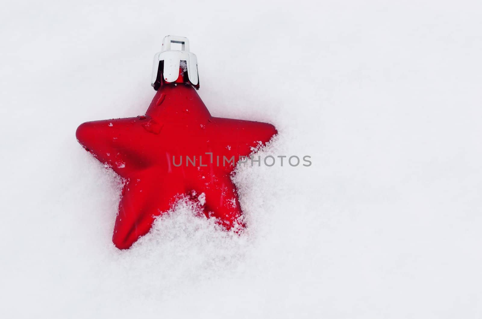 Christmas decoration outside in real snow during snowfall