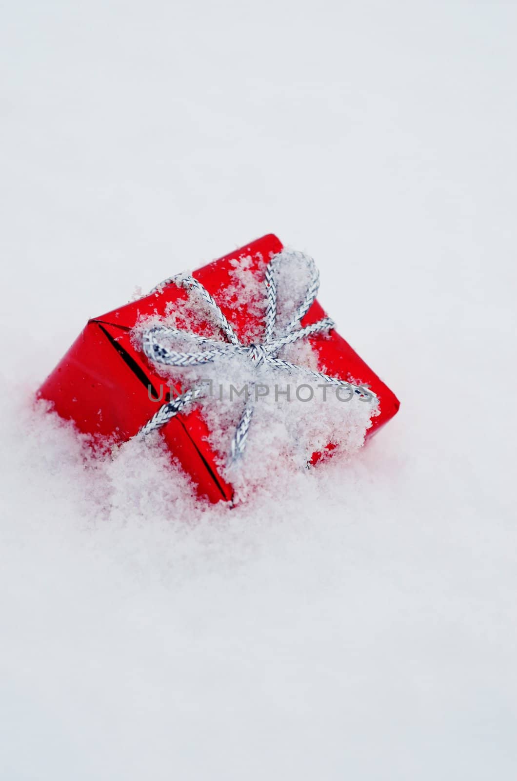 Christmas decoration outside in real snow during snowfall