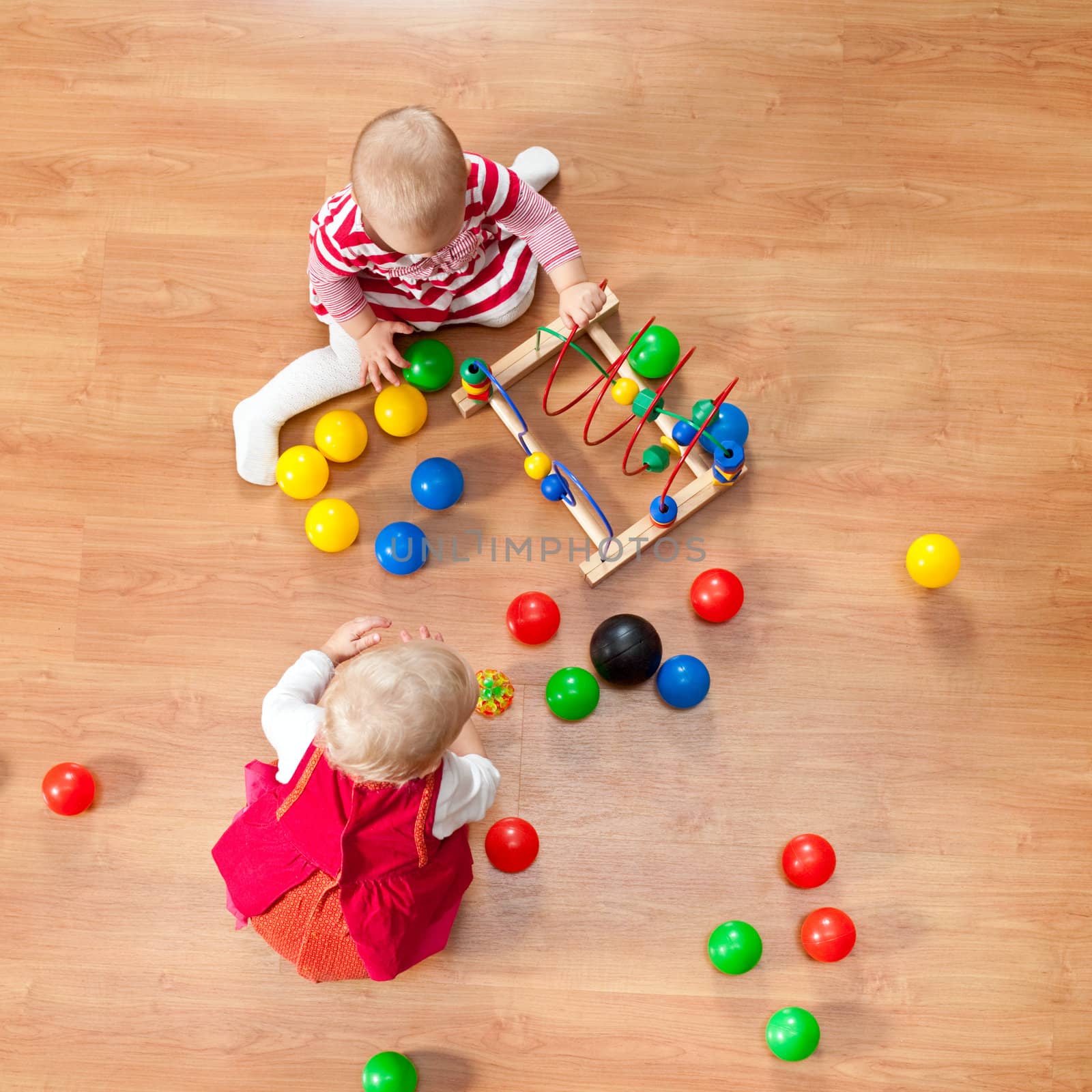 Top view of little girls playing on the floor