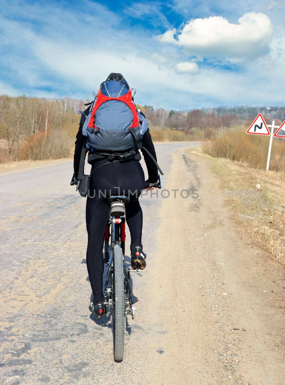Traveling cyclists on country road