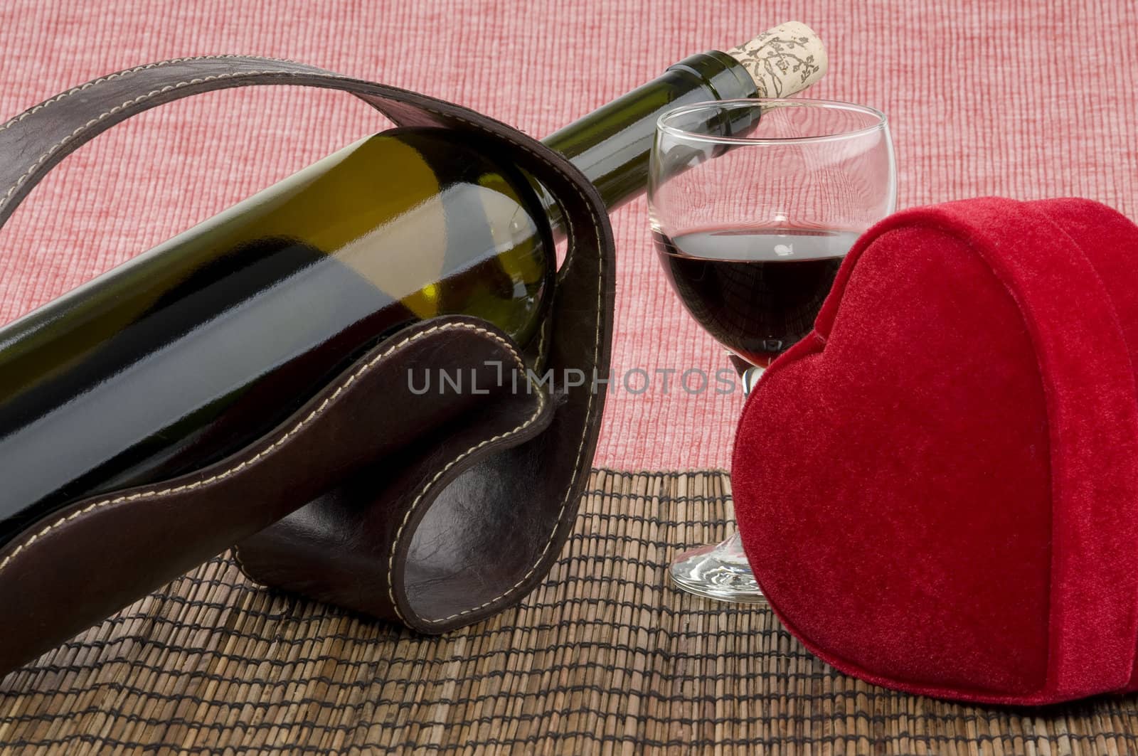 Bottle of wine, glass and red heart shaped gift box by celaler