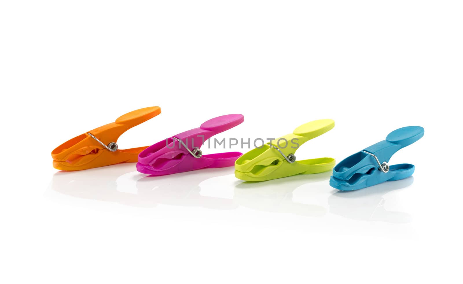 four clothespeg in  green orange pink and blue