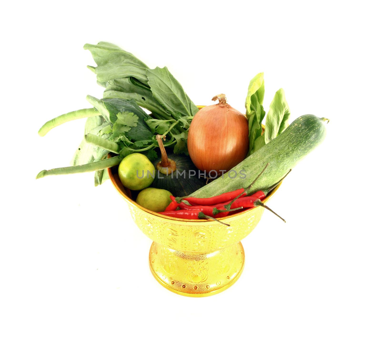 Vegetables mix on golden tray on white background by geargodz