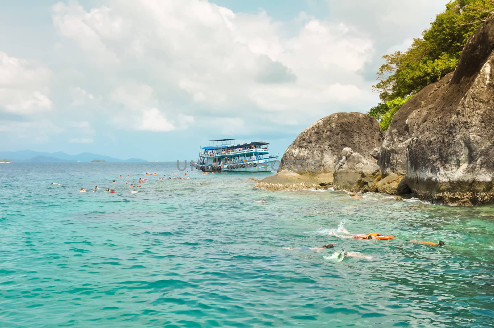 Active traveler diving snorkeling in beautiful clean ocean on summer vacation at Chang island, Thailand