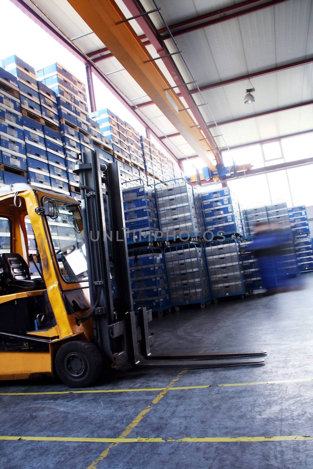 yellow pallet jack in the industrial warehouse