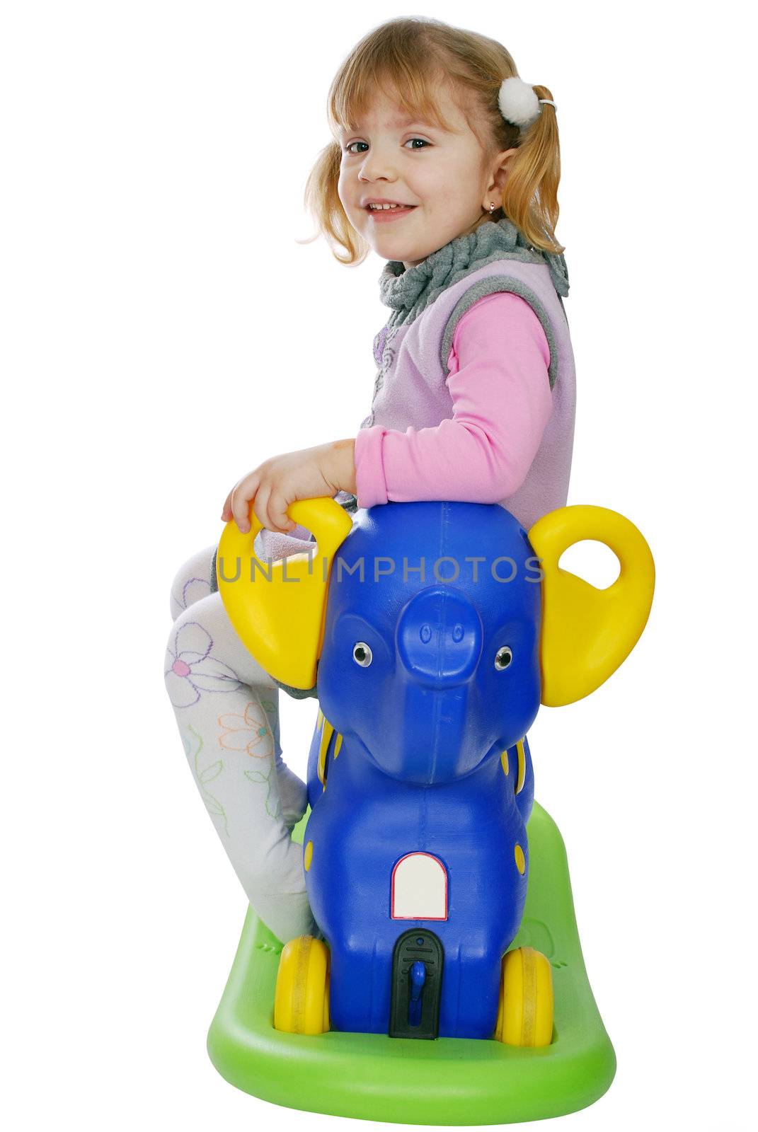 Little girl with elephant toy studio shot