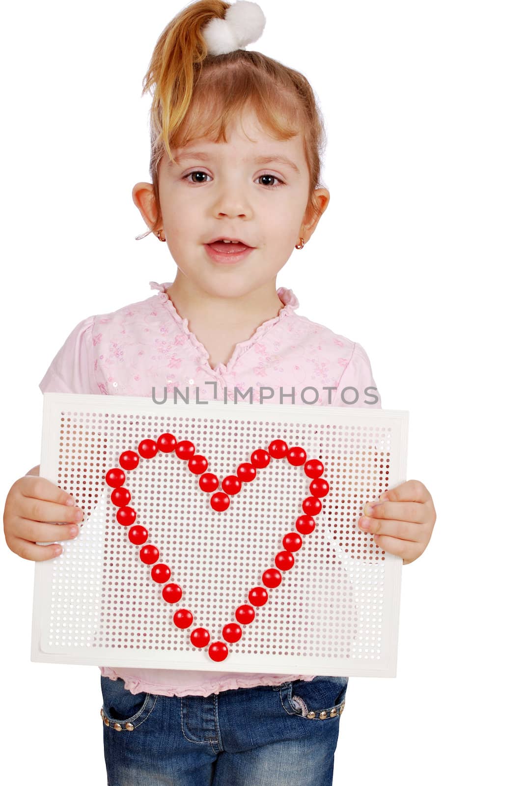 Little girl with heart symbol studio shot