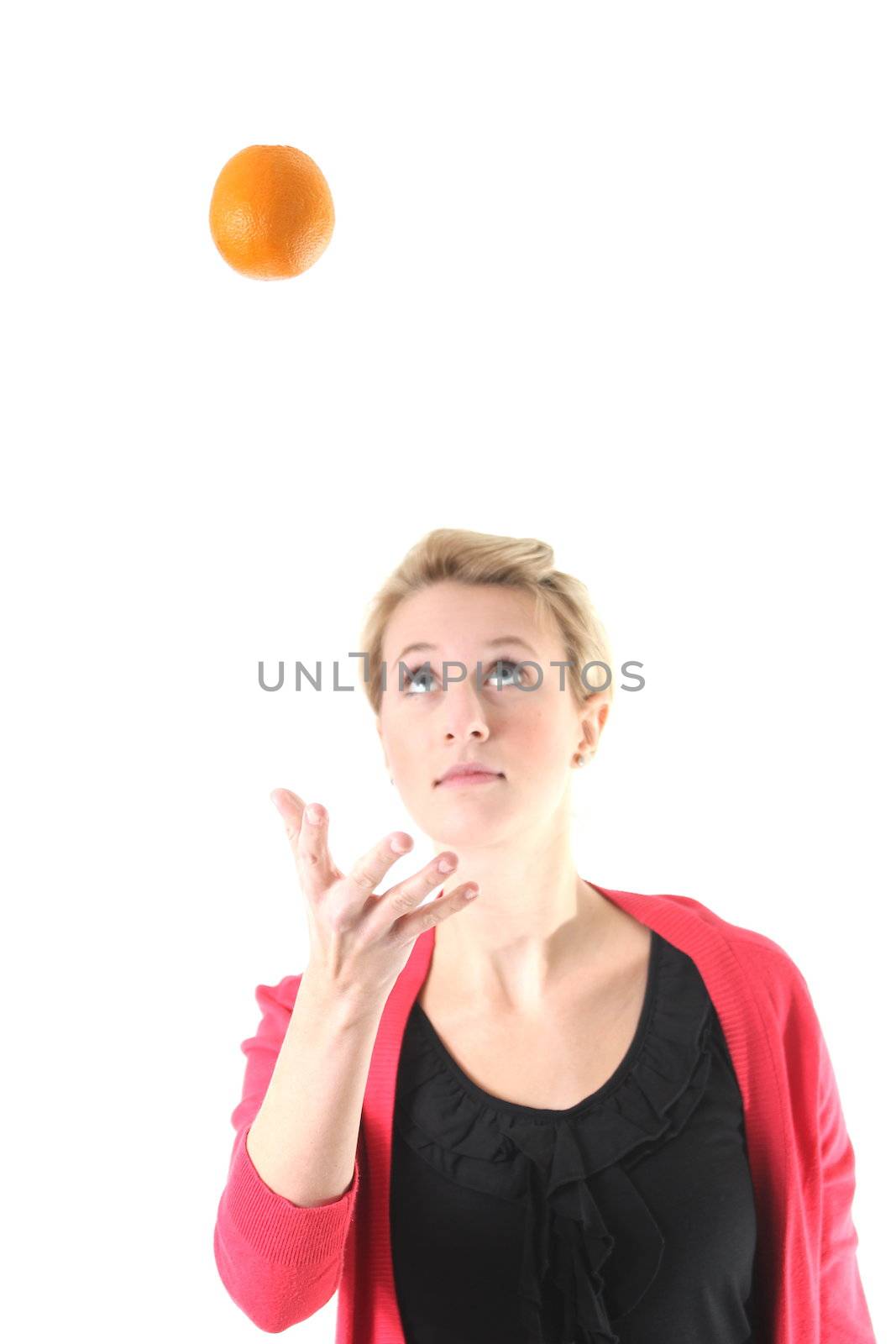 woman juggling with an orange