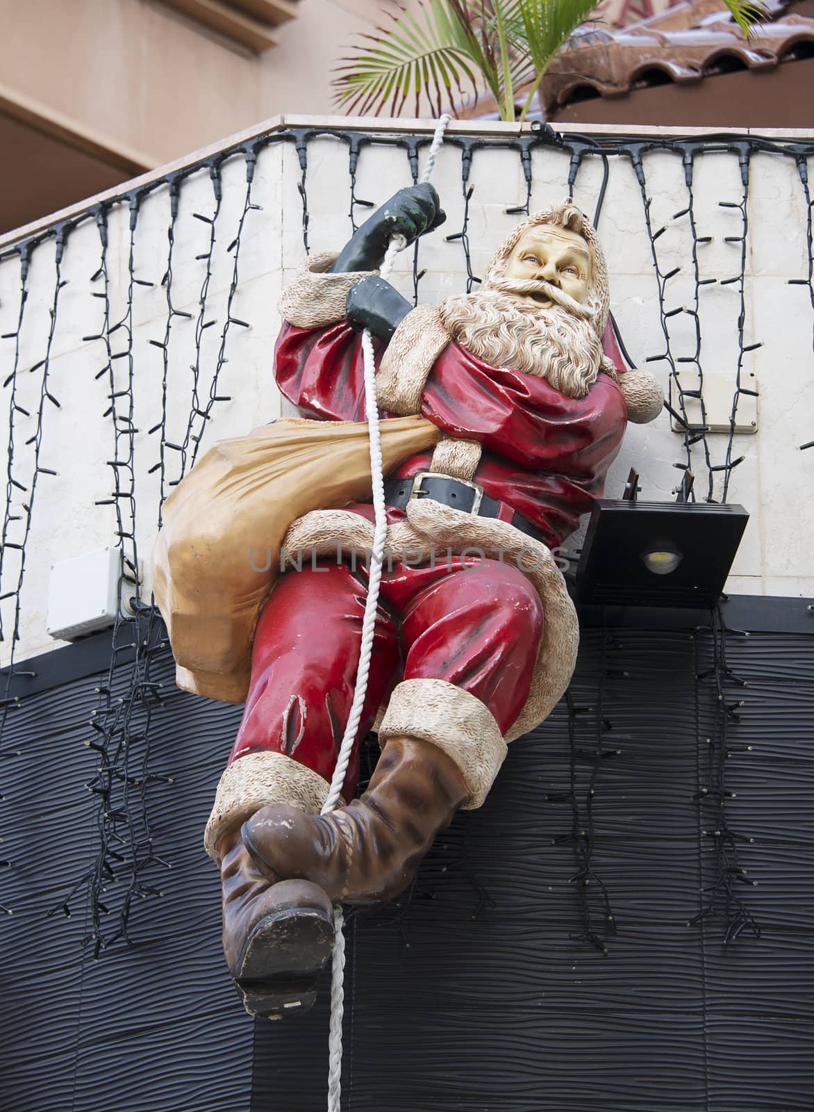 santa clows swinging at rope