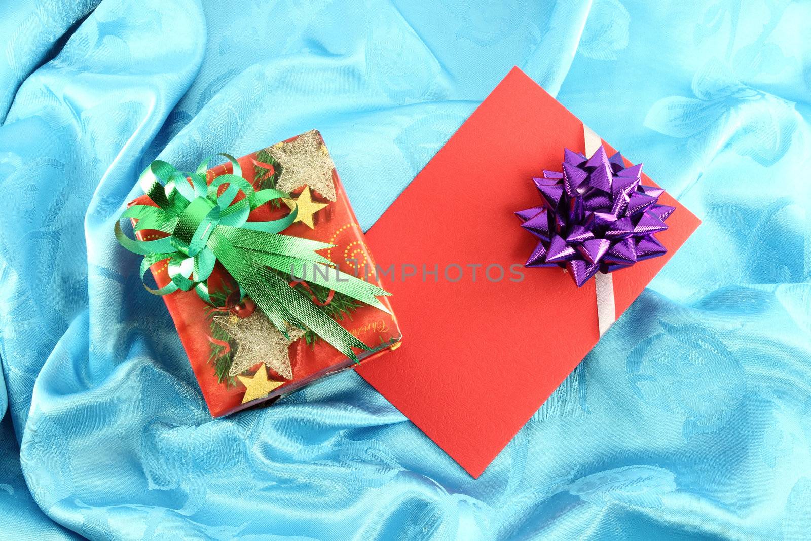 gift box and card on blue satin by geargodz