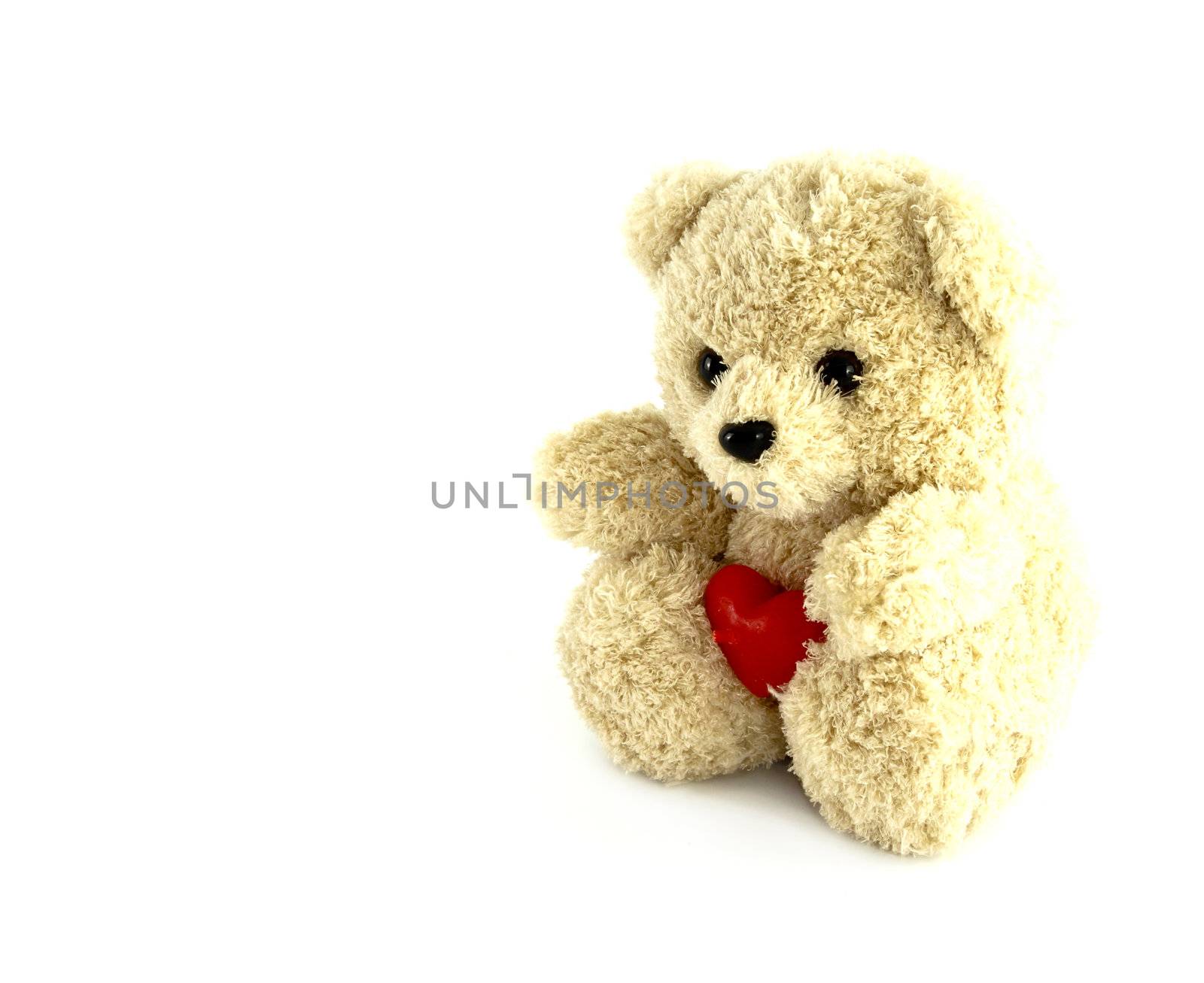 teddy bear toy with heart on white background by geargodz