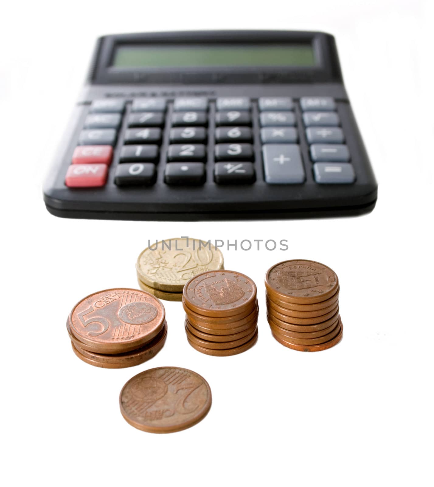 Calculator and coins isolated on white background