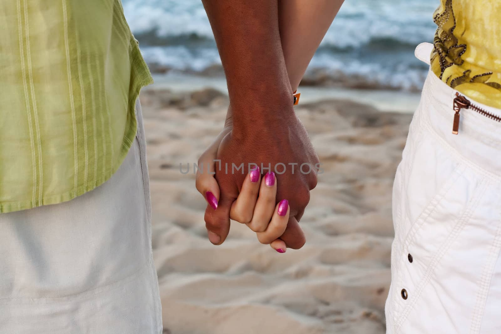 Love on the beach. Love concept.
Hand to hand love. Couple on beach