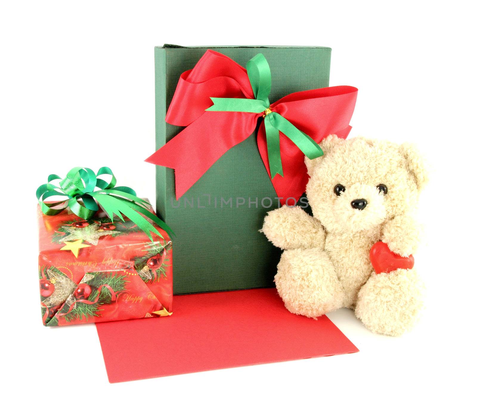 Teddy bear and card and gift on white background