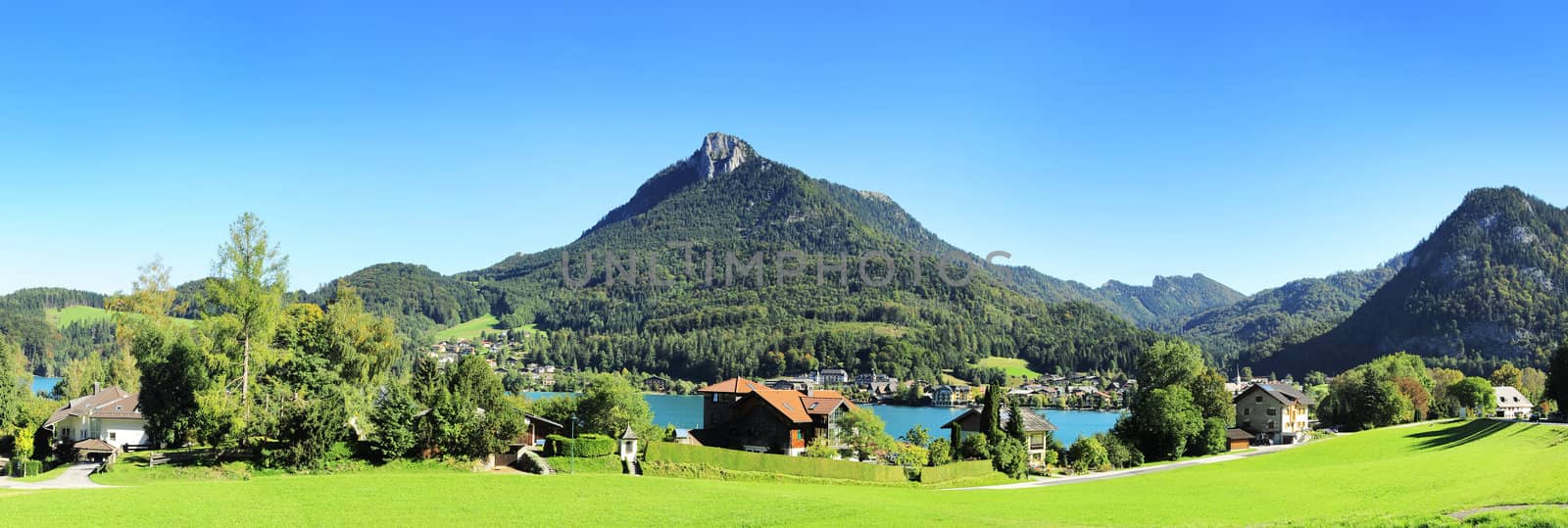 Village near the lake in the Alps mountains. Austria