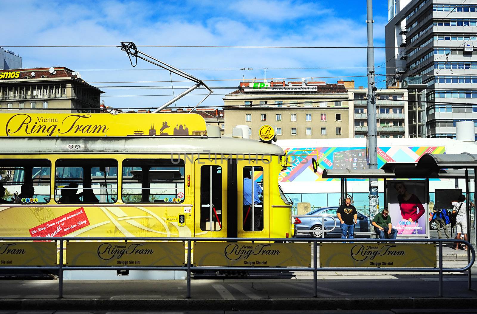 Vienna, Austria -September 26, 2012: The tourist tramway "Ring Tram" waits for passengers . The "ring tram" uses traditional cars with modern interior, showing info about the sights on screens and offering headphones to listen to further information.