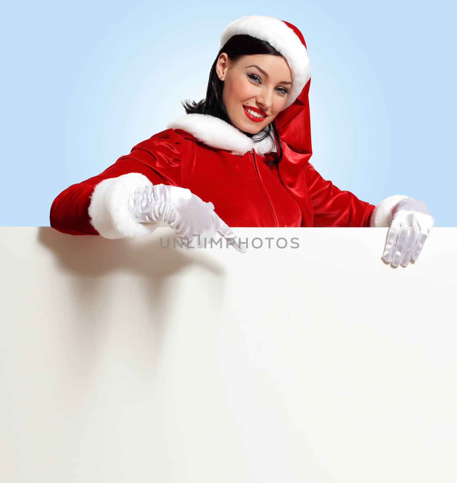 Portrait of a santa girl with a blank banner