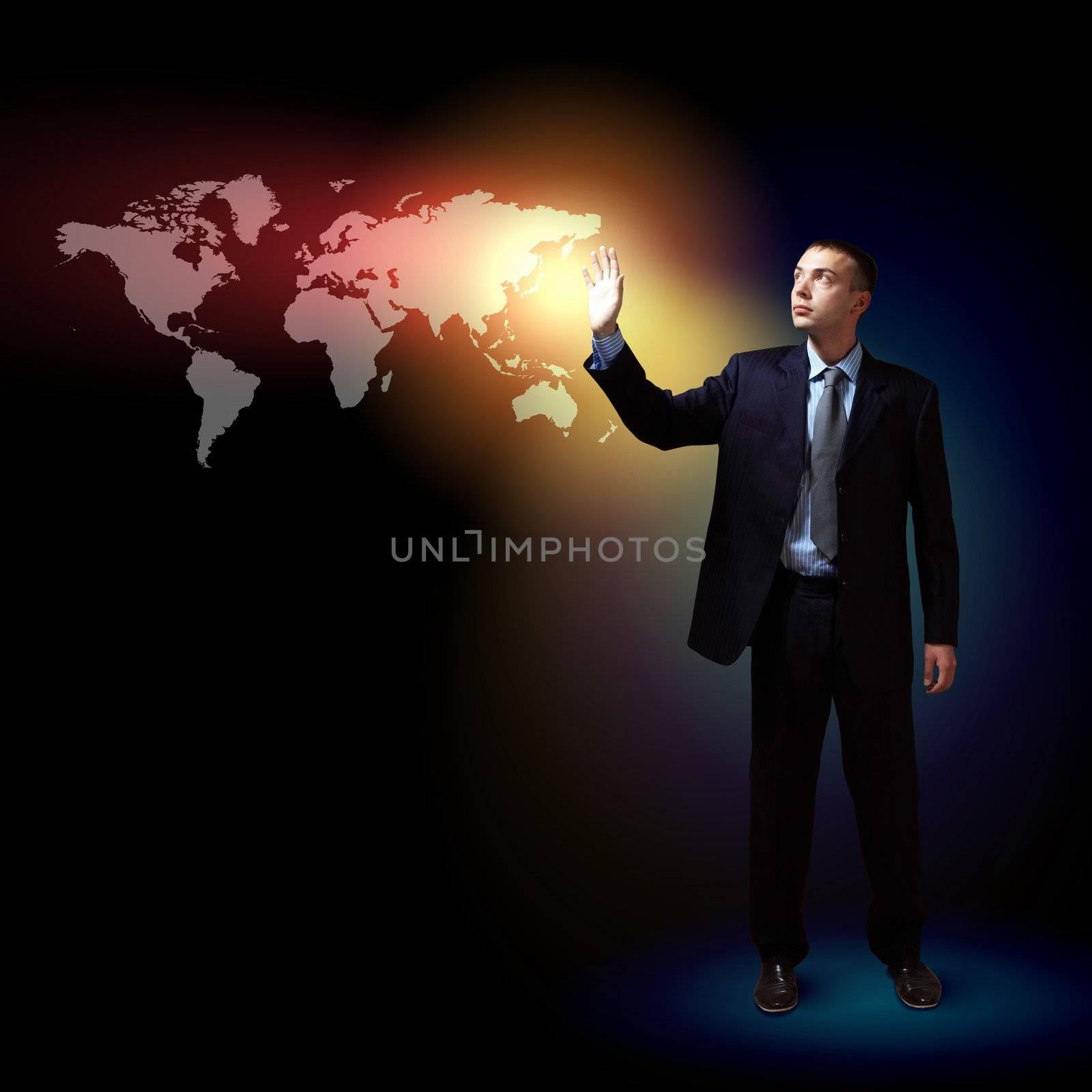 Businessman standing with modern technology symbols next to him