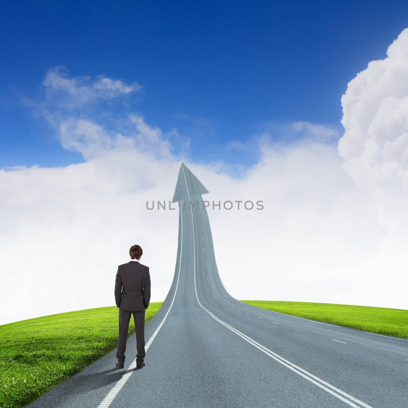 Concept of the road to success with a businessman standing on the road