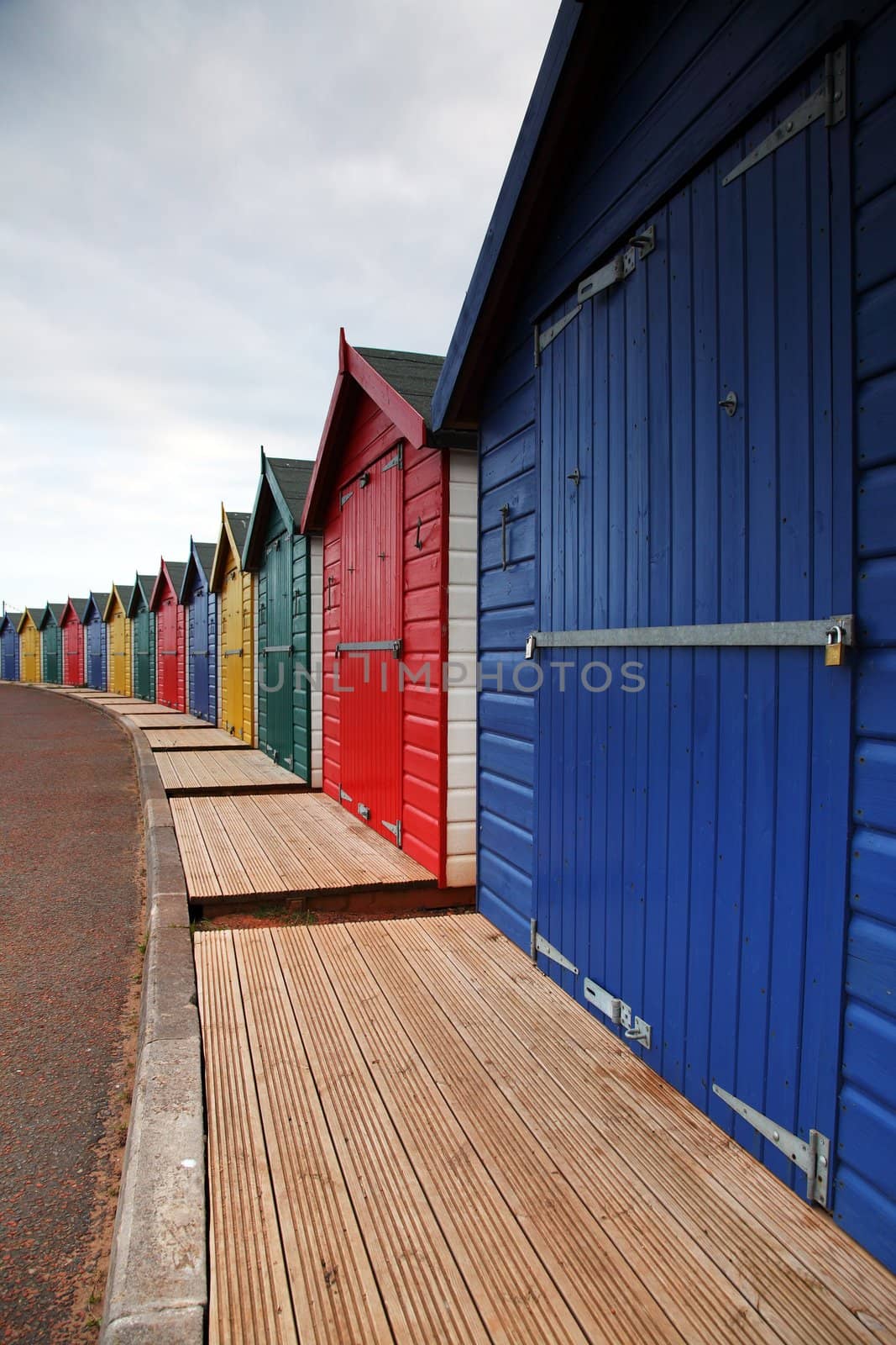 Traditional English beach huts on the beach in summer