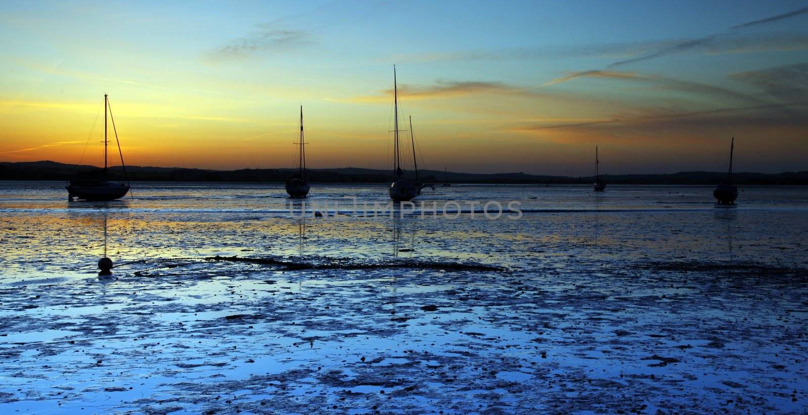 Silhuetted boats  by olliemt