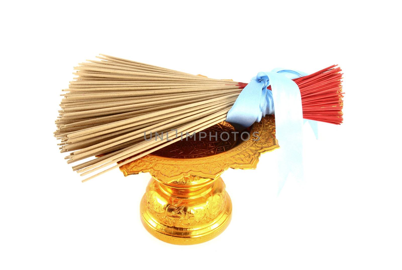 incense on golden tray on white background by geargodz