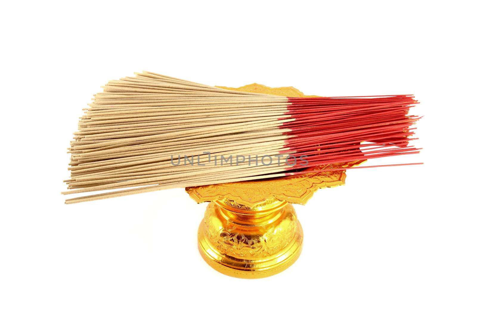 incense on golden tray on white background