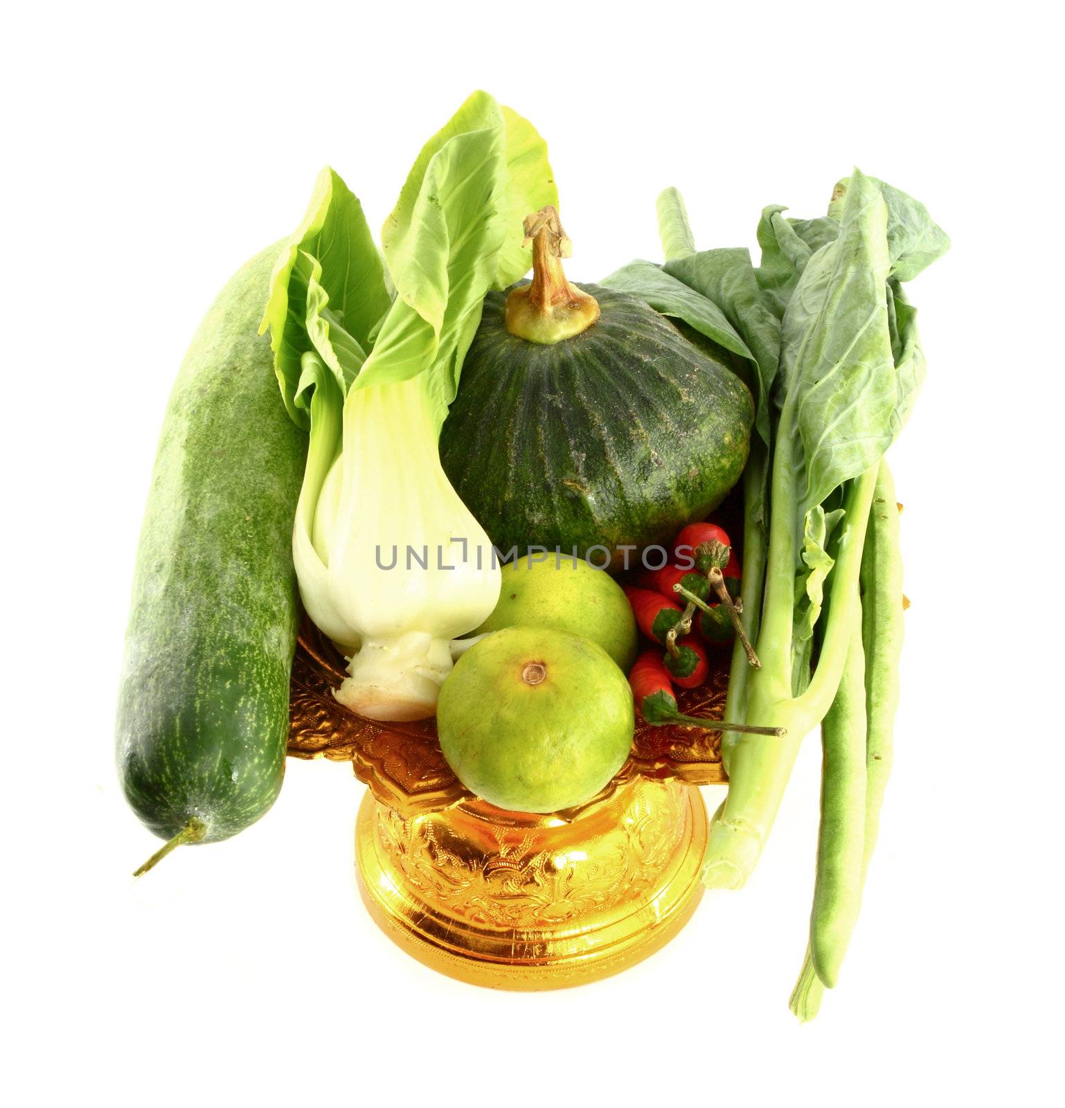 Vegetables mix on golden tray on white background by geargodz