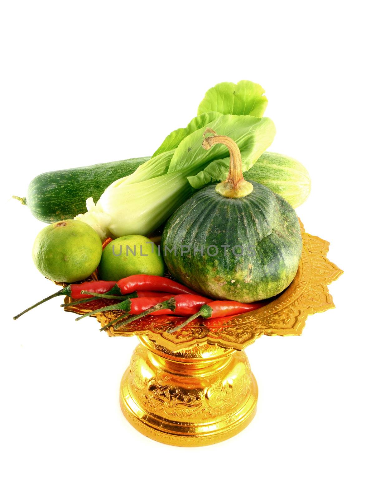 Vegetables mix on golden tray on white background