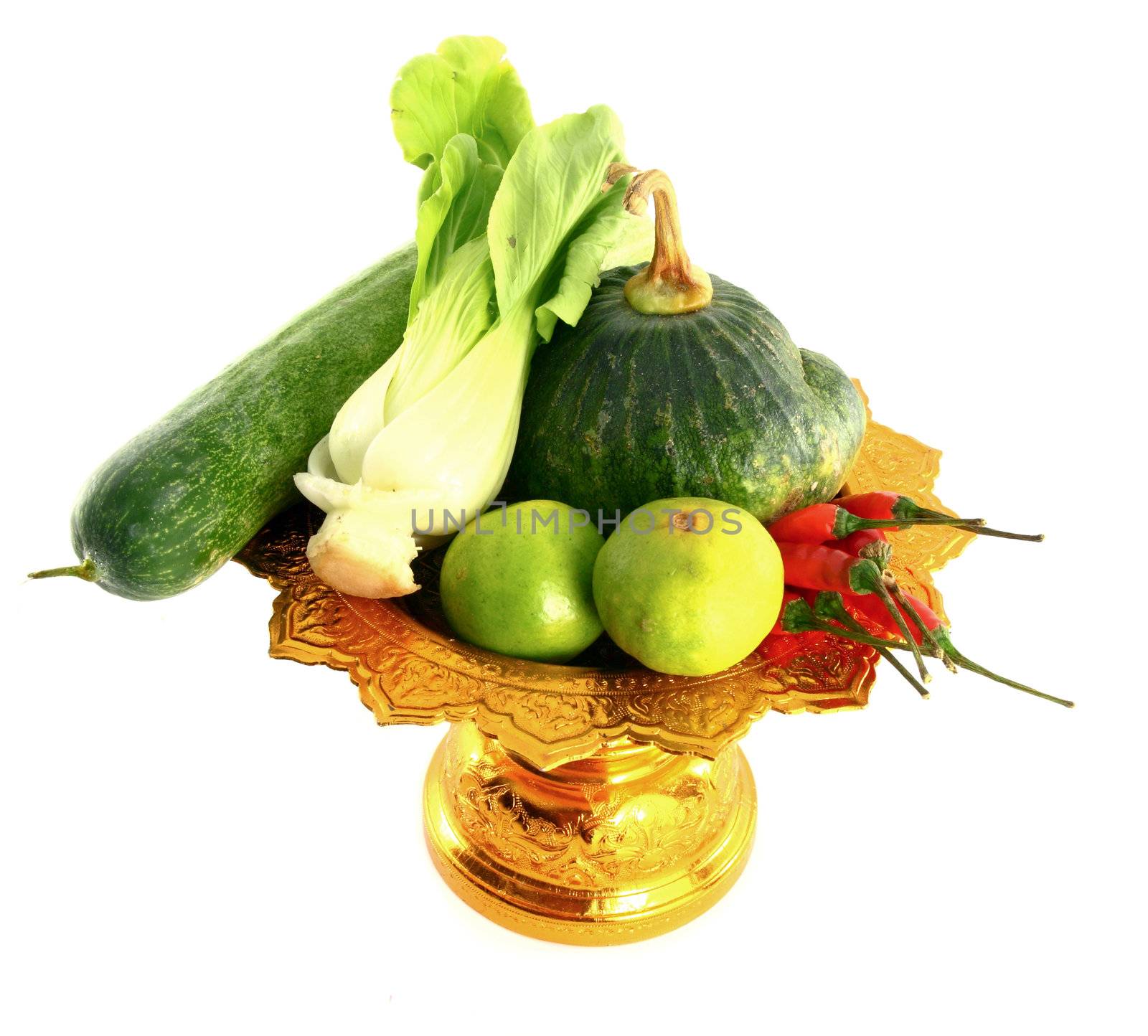 Vegetables mix on golden tray on white background by geargodz
