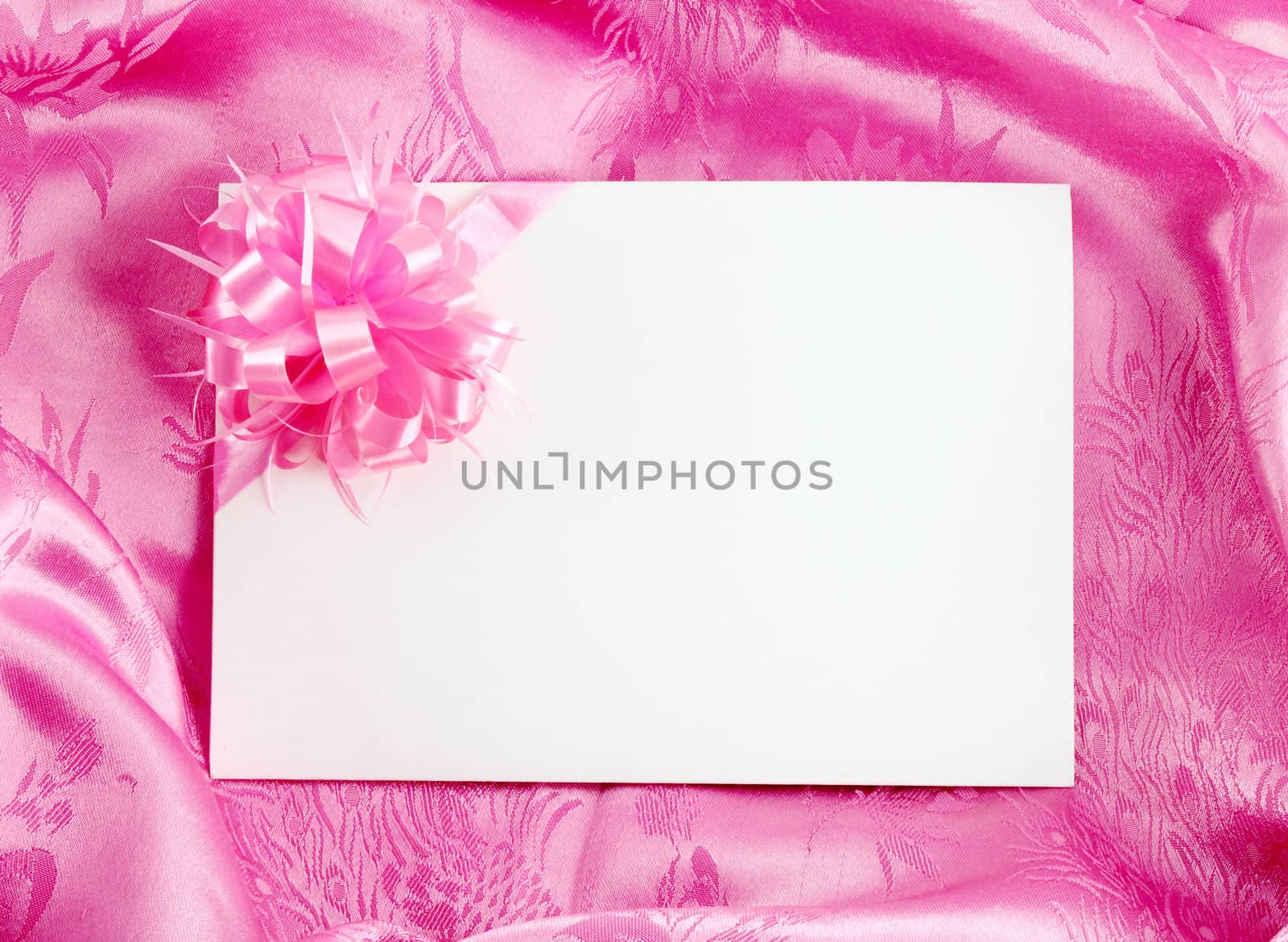 Blank gift card with ribbon on pink satin by geargodz