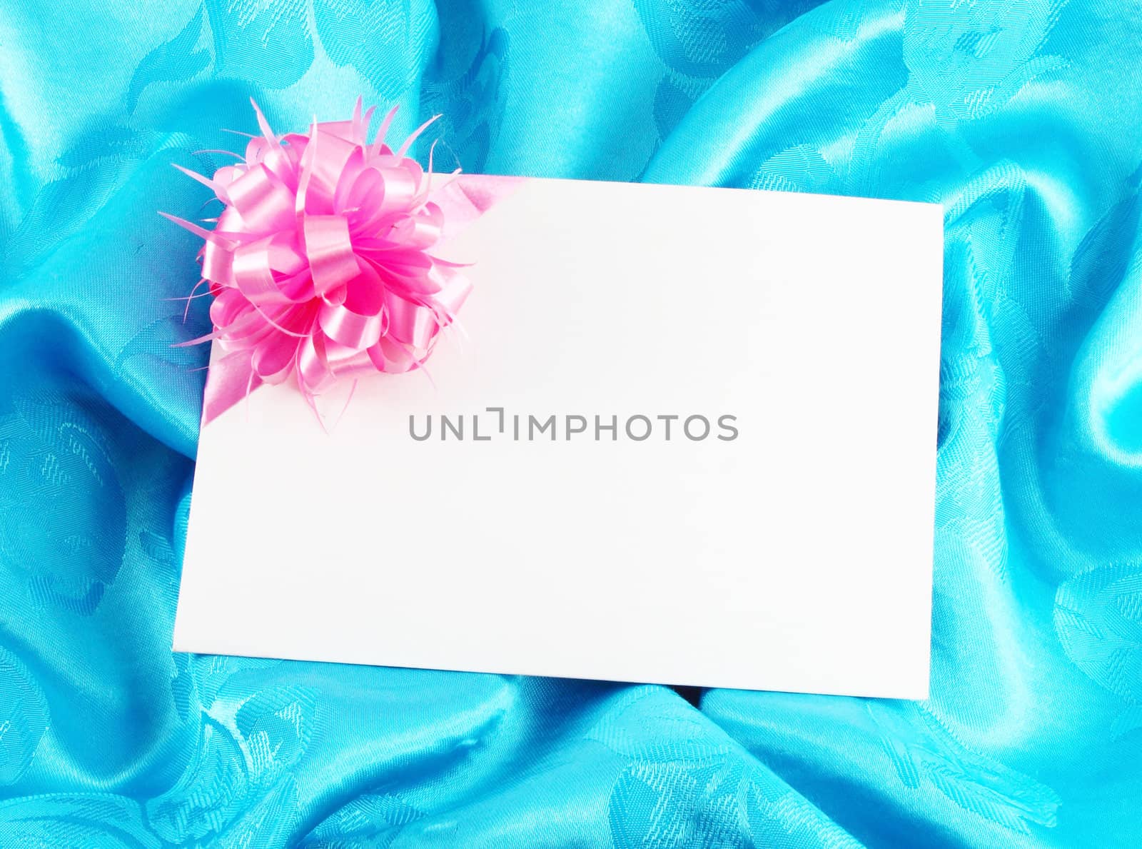 gift card with ribbon on blue satin by geargodz