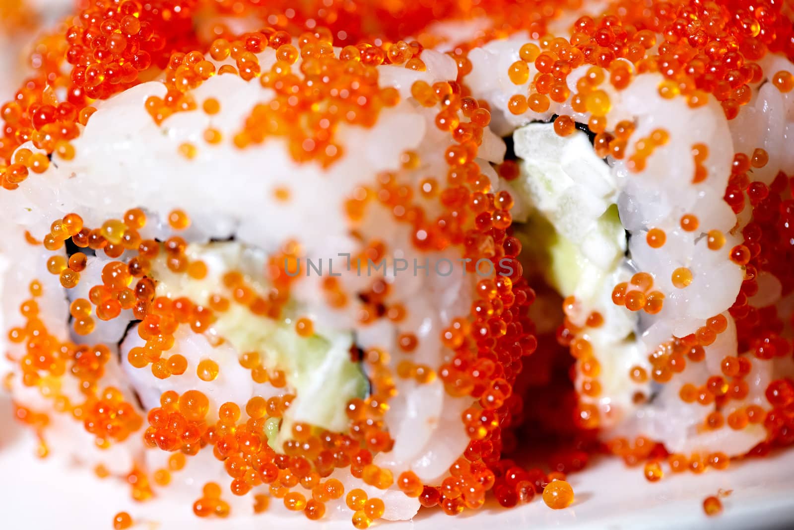 Macro shot of the California roll with red caviar. Shallow dof.