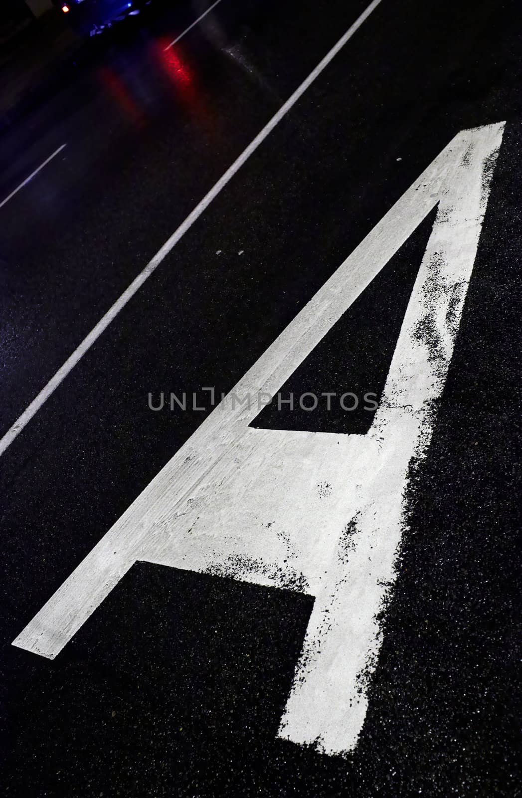 Route A sign on asphalt. Bus line.