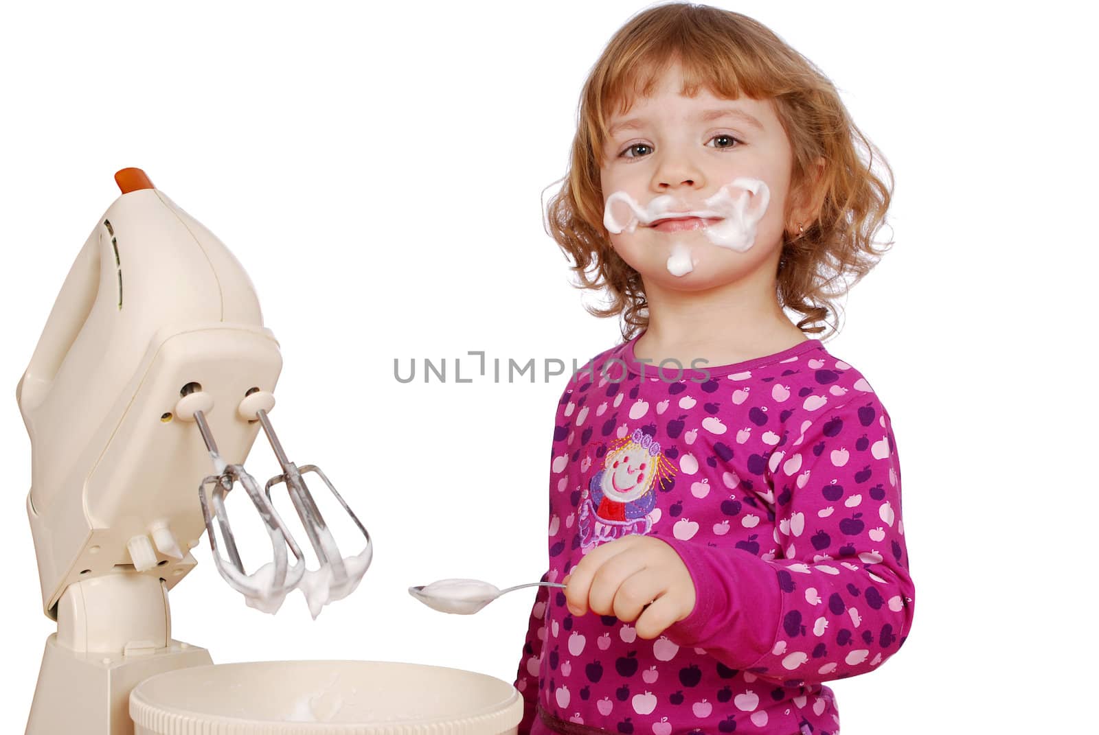 Little girl made cream for cake studio shot
