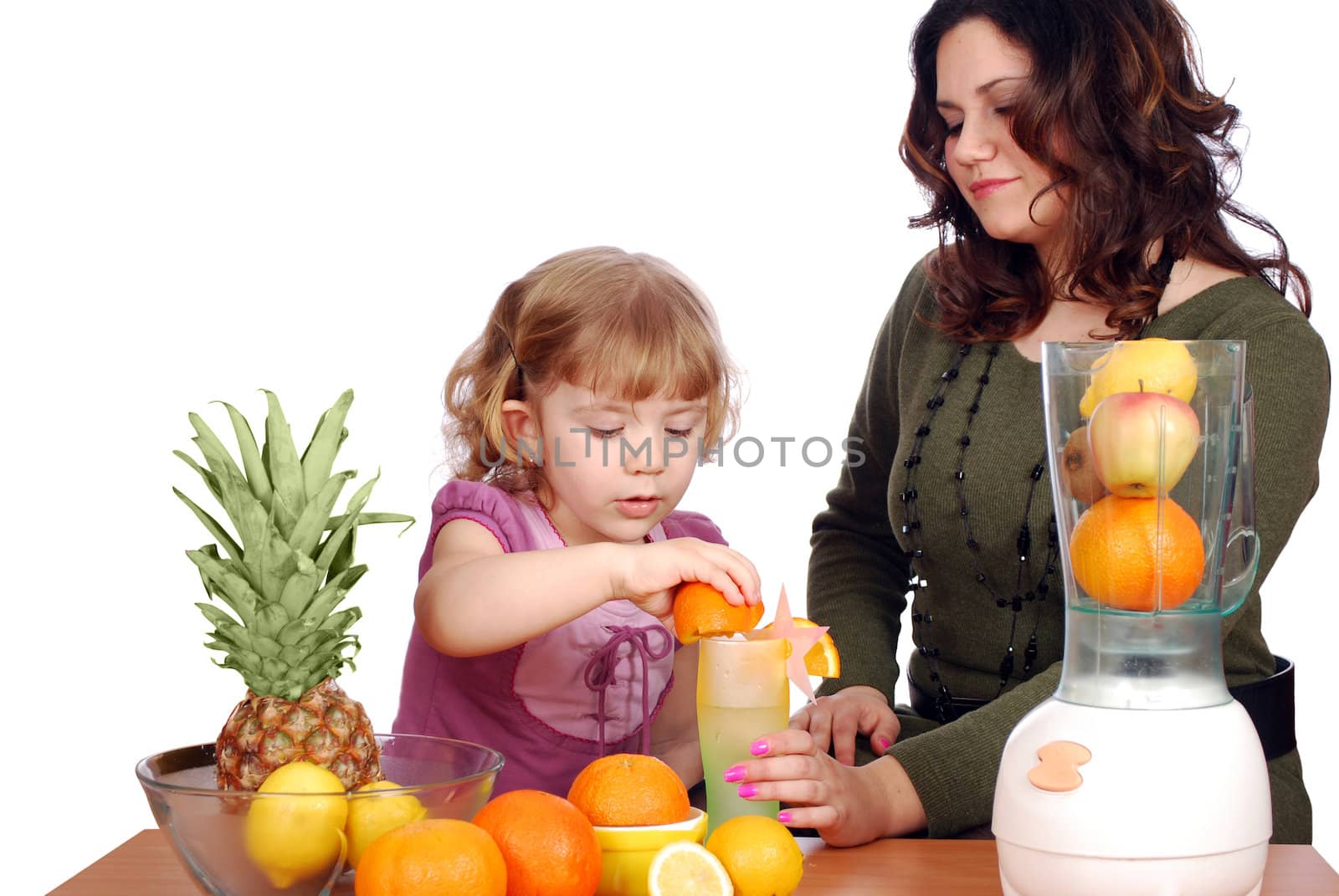 Little and adult girl made fruit juice studio shot