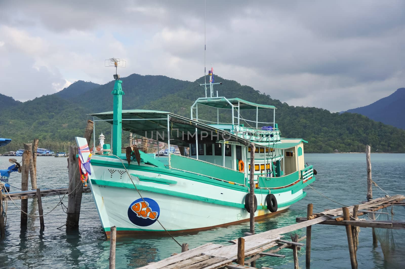 Local tour boat docked at Koh Chang island port, Thailand